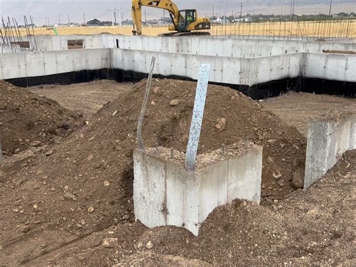 Brandon Nay on Instagram: "After the foundation is complete and has rested for one week, damproofing is applied. Damproofing is a very important step in the building process that helps ensure the moisture in the ground doesn’t seep through to the basement of the home. At Pride Built Homes, we choose to add termite soil treatment at this time as well as a preventative measure. Following those treatments, window wells are installed. We use fiberglass window wells because they don’t dent or rust, a