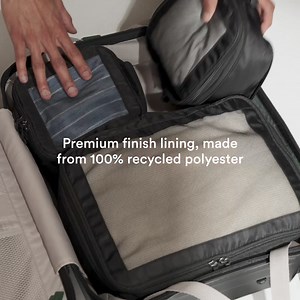 Our Icon Stripe Pocket Suitcase gives quick access to tech without losing interior space. Enjoy quiet travel with Silent Glide 360 wheels and scratch-proof protection. | Antler