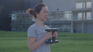 Young Woman Doing Squats with Dumbbells at the Park - Free Stock Video Footage | Coverr