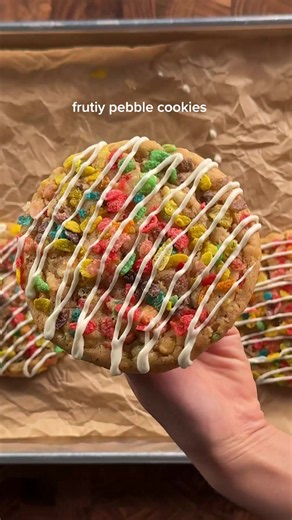 fruity pebbles cookies 2 1/4 cups (290g) ap flour 1/2 tsp (3g) salt 1 tsp (6g) baking soda 2 tbsp (16g) milk powder 1 cup (226g) unsalted butter, soft 3/4 cup (150g) white sugar 1/4 cup (50g) light brown sugar 1 whole egg 1 yolk 2 tsp (8g) vanilla 1/4 tsp lemon extract 1/2 tsp natural strawberry flavoring 2/3 cup (100g) white chocolate chips 1 cup fruity pebbles more for topping *whisk together the flour, salt, baking soda, and milk powder. set aside. in a large bowl, whisk together the butter a