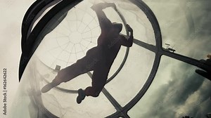 Woman flying in a wind tunnel. Indoor skydiving wind tunnel. Extreme parachuting