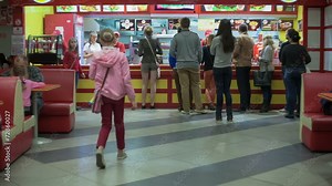 The people at the counter of a fast food