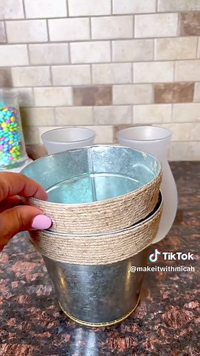 Dollar Tree DIY lantern. 🥰 Perfect for those wark summer nights. Just make aure to keep it covered when it rains. 🥰 The solar light will need about 24 hours under the sun to charge. Everything I used is from the DT. To make one you will need: • 1 galvanized planter • one tapered glass vase • 1 bag of white pebbles • 1 bunch of lavendar flowers • 1/2 roll or burlap ribbon • 1 solar stake light • hot glue • frosted spray paint (brand is @rustoleumbrands from @walmart ) Questions encouraged 🥰 #d