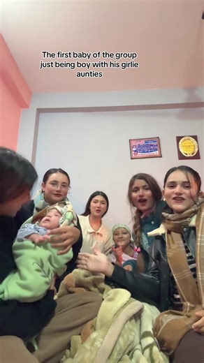 Adorable Baby Boy Enjoying Time with His Aunts