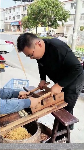 Two-Person Teamwork on a Traditional Sweet Potato Shredder