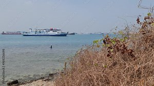 Merak, Indonesia on July 9 2023. A ferry ship with the code Ferizu is heading to the port of Merak. The jargon of this ship is "We bridge the nation"