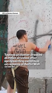 A woman protesting the rise of Germany’s populist right-wing party was busted for scrawling swastikas while completely topless — and looking like Nazi leader Adolf Hitler. | New York Post Video
