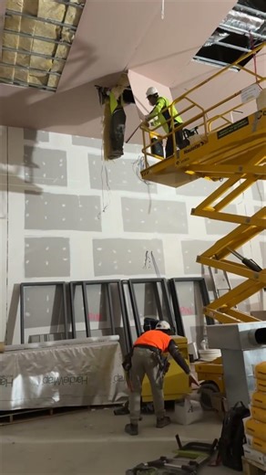 Worker Dangles From Ceiling as Coworkers Rush to Help