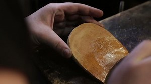 Glue for shoes. Shoemaker sews shoe. Bonding shoe soles. Close up