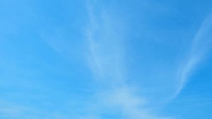 4K : Blue sky timelapse - Time-lapse captures the dynamic beauty of the sky as clouds gracefully drift through a brilliant blue backdrop. Nature's artwork, in constant motion. Spring sky background.