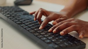 Young employee typing information on computer, using keyboard to create new online report and send professional email. Woman checking company sales and doing accounting work at home. Close up.