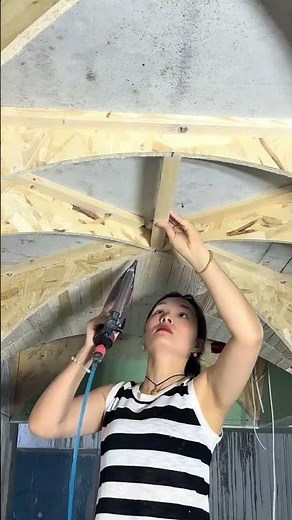 Carpenter Demonstrates The Process Of Installing Curved Ceiling