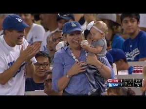 Fan with baby ends up with foul ball