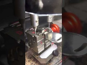 Black Widow key cutting machine. Decoding key by picture then cutting it on the machine.