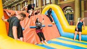 Huge inflatable obstacle course to open week with mega slides and DJ sessions