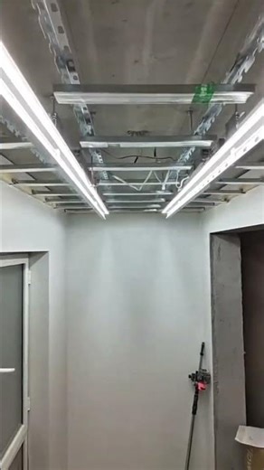 Installing roof light cables carefully to ensure safe bright lighting across the entire ceiling area