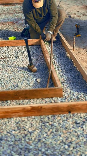 Bringing a unique twist to concrete — our latest patio features a two-tone finish and intricate paver inlay. #compassoutdoorliving #outdoorliving #concrete #landscaping #hardscapecontractor | Compass Outdoor Living