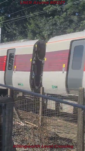LNER Azuma 801227 Passing through Killingworth Level Crossing at speed