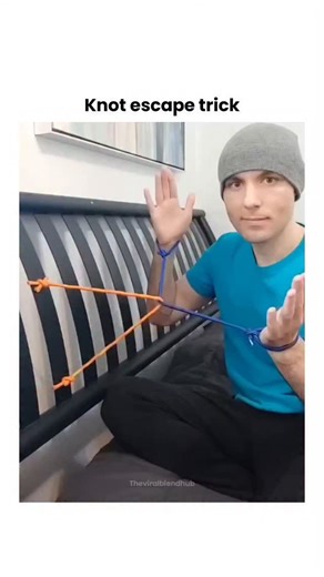 Theviralblendhub on Instagram: "This post by showcases a 1,000-year-old Indian "Magic Knot" escape trick, where orange ropes appear to bind wrists but release via precise pulling and twisting motions. The technique relies on slip-knot physics: introducing slack at a 90-degree angle to the tension line allows the loop to unravel without tools, as demonstrated in the 14-second video. Viewer replies highlight its practicality for self-rescue scenarios, though success depends on rope length and hand