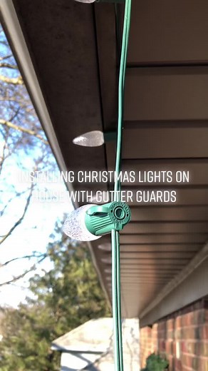 How to install holiday lights on a housecwith gutter guards. #christm...