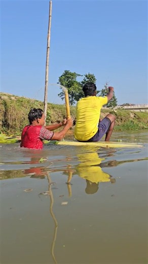 A man sitting in water. Another man hits him from the side 😂