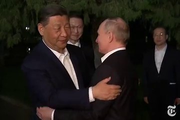 Xi Hugs Putin