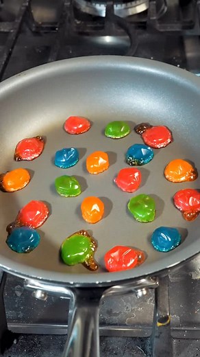 Kailyn Klein on Instagram: "Will these exploding gushers be a match for the nonstick pan? #candy #snacks #food"