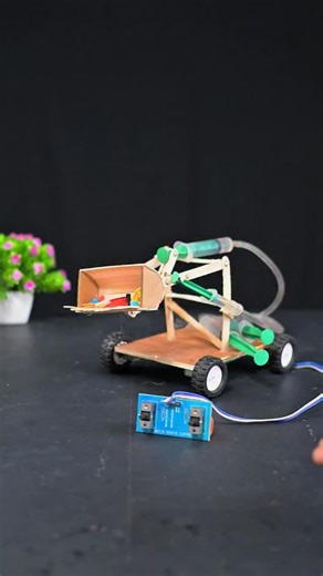 Creative SM on Instagram: "DIY JCB Project With Hydraulic System #shorts #project #schoolproject #scienceproject #trending #diy"