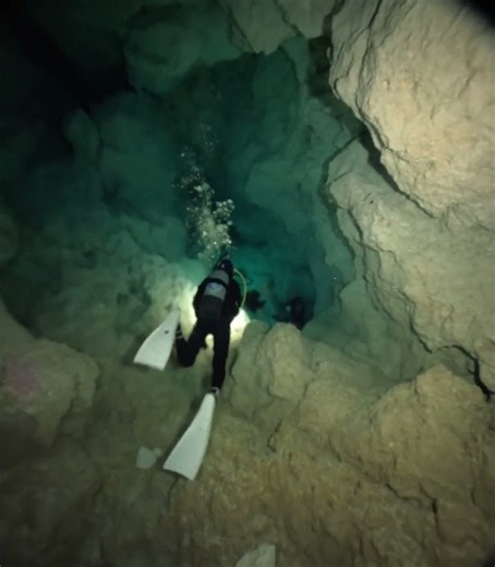 Divers Explore the White Rock Walls of Minami-Daito Cave || ViralHog