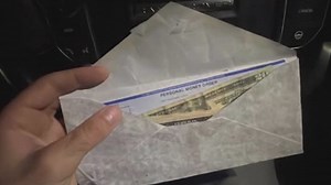 Man uses social media to locate owner of envelope full of cash