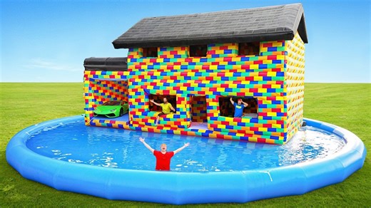 The entire house is literally floating right now – The inflatable Lego house has left solid ground