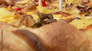Zoomed-in pizza perfection: gooey cheese and savory sausage, a slice of heaven in every frame. Cuisine and ingredients concept. Macro footage. Pizza background. 4K.