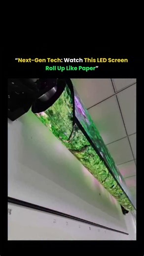 The Daily Spectrum on Instagram: "“The Screen That Rolls Up Like Paper 😳✨” This isn’t sci-fi — this LED display bends and rolls like a magazine page Ultra-thin pixel panels = flexible, lightweight & insanely portable Future homes may replace TVs with rollable walls Ideal for ads, events & rooms where every inch matters Tech like this could make foldable phones look basic 👀 👉 Tag someone who loves next-gen gadgets! ❓ Would you install a rollable screen at home? #TechNews #FutureIsNow #GadgetLo