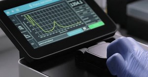 Medicines, laboratory chemicals, skin care products development. Scientist or chemist works in a laboratory, drops sample on spectrophotometer using pipette. Tashkent, Uzbekistan - February 15, 2024