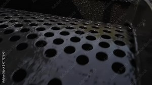 Rotating Industrial Trommel Screen Machine. Mining Equipment. Close Up Of Trommel Screen Machine For Solid Rock Waste Separation. Trommel Screen Machine Sorting Valuable Stone Material From Scrap