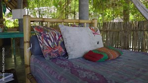 Mixed raced friends speak in chill out zone outdoors. The women have a good time conversating