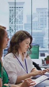 Vertical Video Job candidate sits across from interviewers team in high end office, presenting qualifications and discussing various job opportunities or career paths within the company. Employment