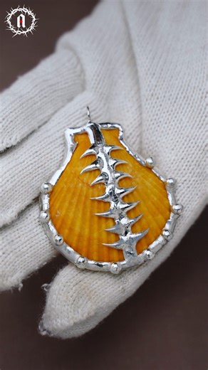 SolderAlchemy on Instagram: "An orange shell, burnished by salt and time, ringed with soldered beads like scattered scales. 🧡 Each one catching light as it moves with you. Beat the rush. Order now for Valentine's Day. ✨ Lin in bio! #ValentinesDay #valentinesdaygift #softsolderjewelry #ShellJewellery #shellnecklace #solderedjewelry #gothicjewelry #solderalchemy #handcraftedjewelry #handmadejewelry #soldering #solderart #diyaccessories #alternativejewelry #StatementPiece #OneOfAKind #funkyjewelry