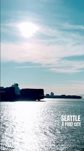 Seattle is a port city, with container ships coming and going from Port during a spring sunset.