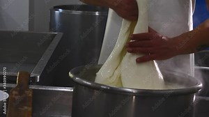 preparation of mozzarella in a dairy. mozzarella production: italian cheese factory, mozzarella, fresh cheese