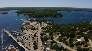 Cinematic aerial view of the Parry Sound waterfront on the shores of Georgian Bay, Ontario.