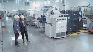 Factory Digitalization: Two Industrial Engineers Use Tablet Computer, AI Big Data Analysis. Visualization of High-Tech Facility into 3D Rendered Neural Network. Industry 4.0 Machinery Manufacturing