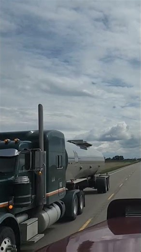 sweet green 389 peterbilt pulling a tanker
