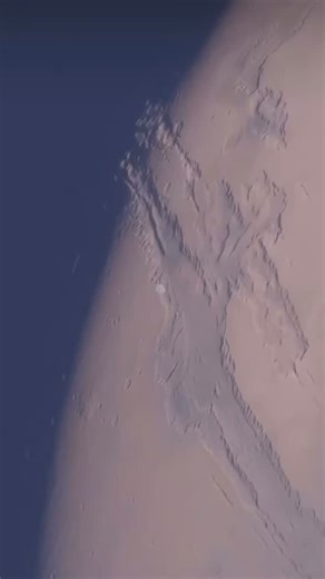 What We Know About the Universe on Instagram: "“Phobos: A Close Pass Above Mars’ Mysterious Moon” This stunning view captures Phobos — the larger and closest moon of Mars — as seen from an incredible perspective. Its irregular shape, cratered surface, and eerie shadows make it one of the most fascinating objects in our solar system. Dive into the beauty of space and explore the cosmic wonders that surround the Red Planet! 🌑🚀 #Phobos #MarsMoon #SpaceReel #AstronomyVideo #CosmicView #MarsOrbit #