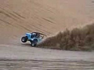 Willys CJ3B jeep goes to the top of massive sand dune