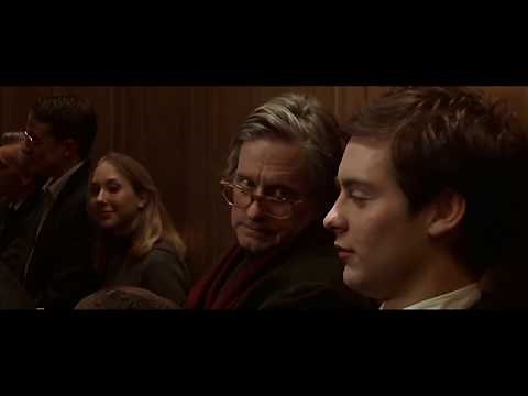 Tobey Maguire laughing loudly in an auditorium