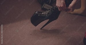 Drag Queen Getting Dressed Backstage before Performance in Dressing room