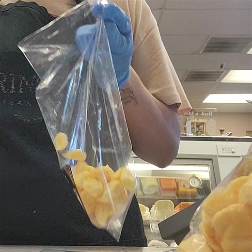 🧀💨 It’s National Cheese Curd Day, and the team is on a mission! She’s bagging up today’s fresh curds faster than you can say “squeaky snack attack.” Stop in and grab your share before these little bites of joy disappear, because nothing celebrates the day better than fresh Springside Cheese curds! Hurry fast - there is still time! #SpringsideCheeseWI | Springside Cheese