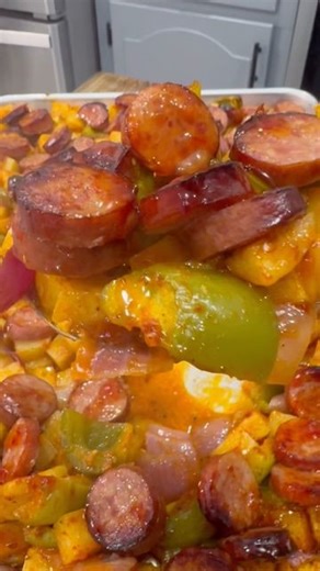 Luke Brown on Instagram: "This Kielbasa Sheet Pan Meal is easy to make and one the whole family enjoys! INGREDIENTS (2) 12 oz packs of Beef Kielbasa 3 large potatoes 2 green bell peppers Red onion 2 tbsp olive oil Salt, pepper, garlic powder, paprika Buffalo Wild Wings Asian Zing INSTRUCTIONS Slice the kielbasa into thin rounds. Cut the peppers and onions into pieces all about the same size. Peel, wash, and chop the potatoes. Be sure to cut the potatoes into smaller cubes. Add the potatoes to a 