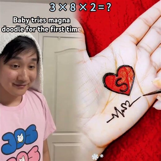 Baby tries the magna doodle for the first time